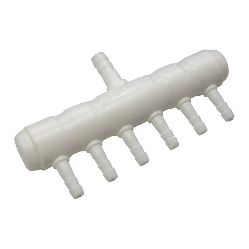 White plastic component with multiple small pipes on a white background