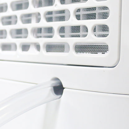 Close-up of a white air conditioner with a focus on the filter and fan.