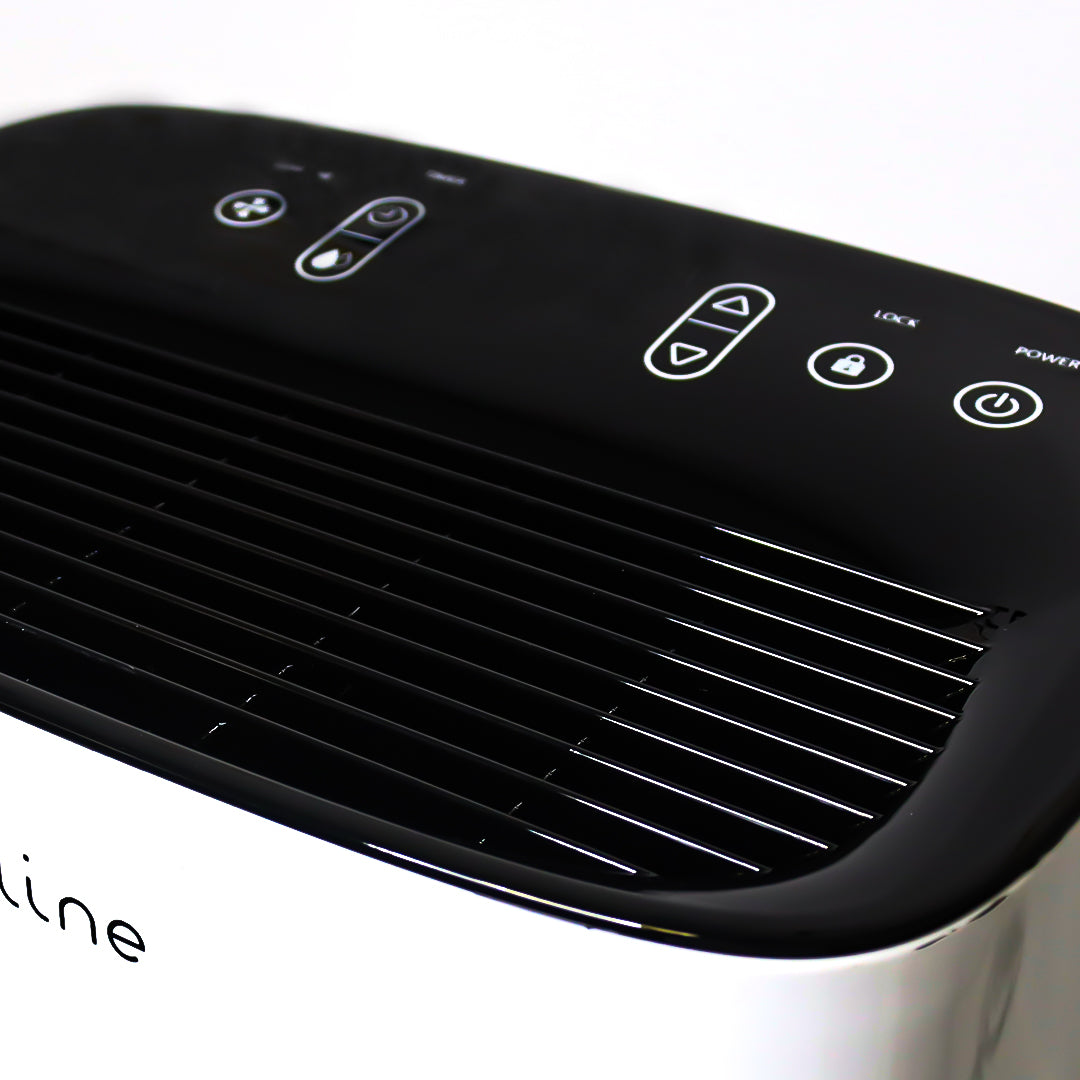 Black and white air purifier with control buttons on a white background