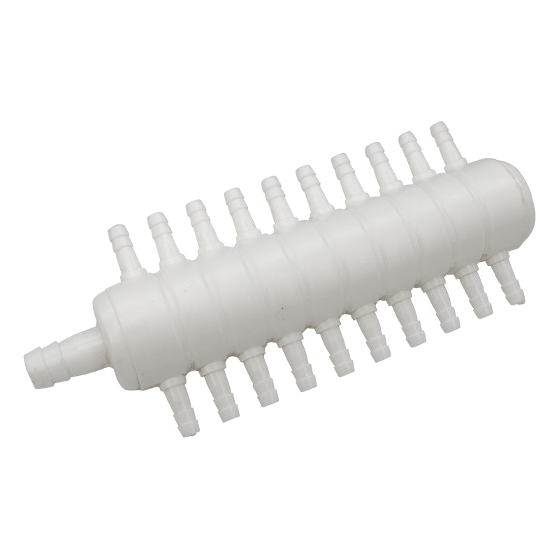 White plastic component with multiple nozzles on a white background