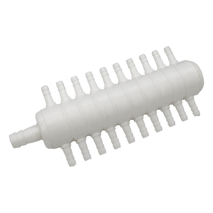 White plastic component with multiple nozzles on a white background
