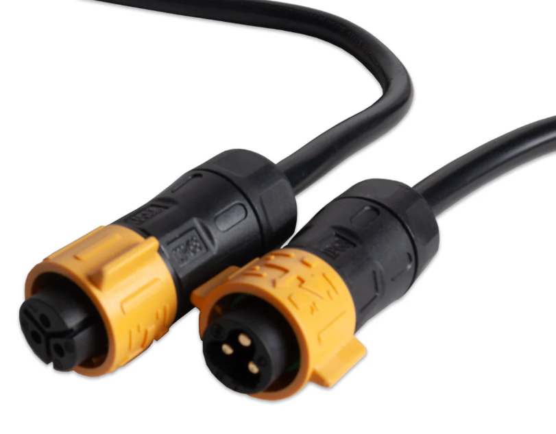 Two black and yellow electrical connectors on a white background