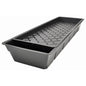 Black plastic seedling tray with drainage holes on a white background